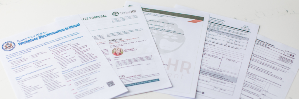 Paper documents all laid out to fill out for HR